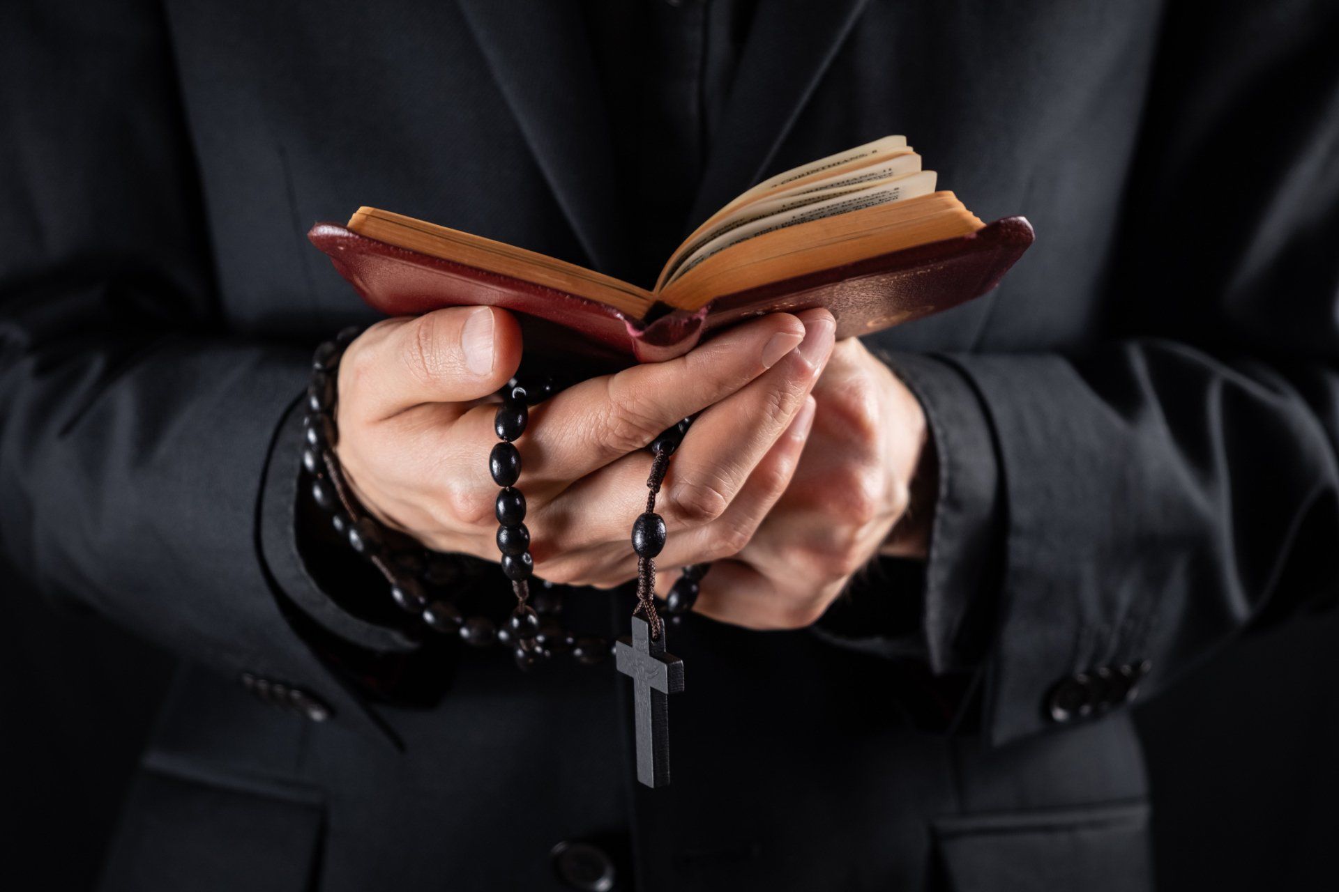 Holding Bible and Rosary