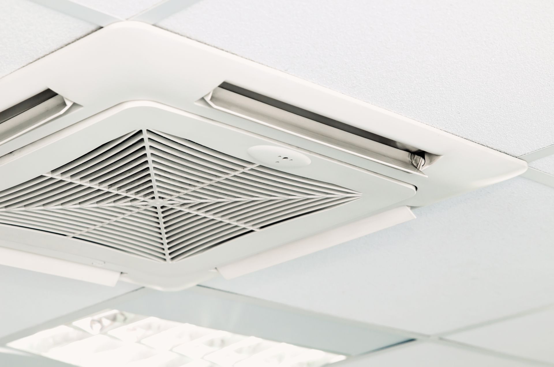 A close up of a ceiling fan in a room