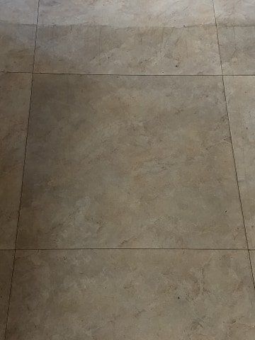 A close up of a tiled floor in a room.