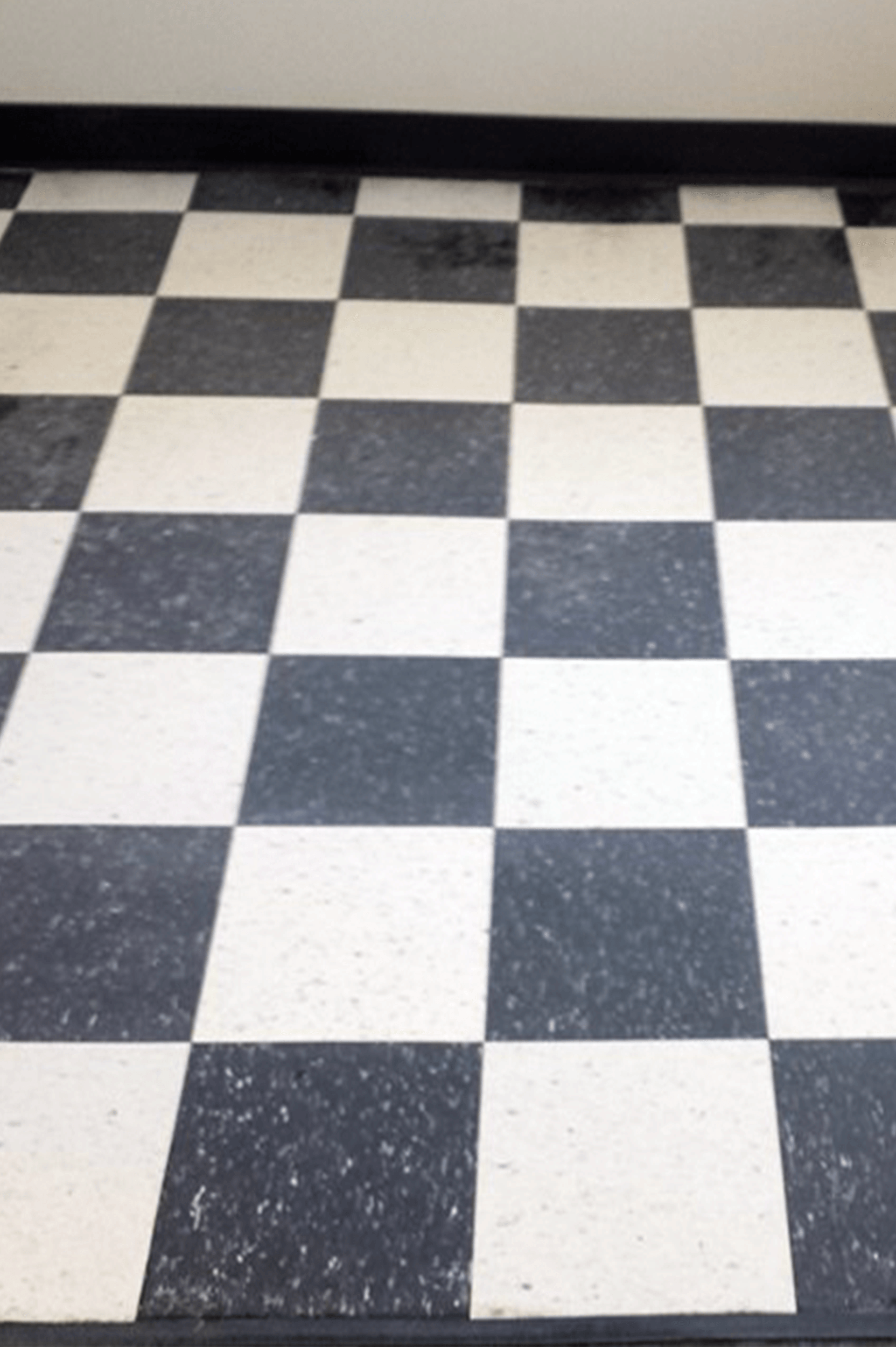 A black and white checkered floor in a room