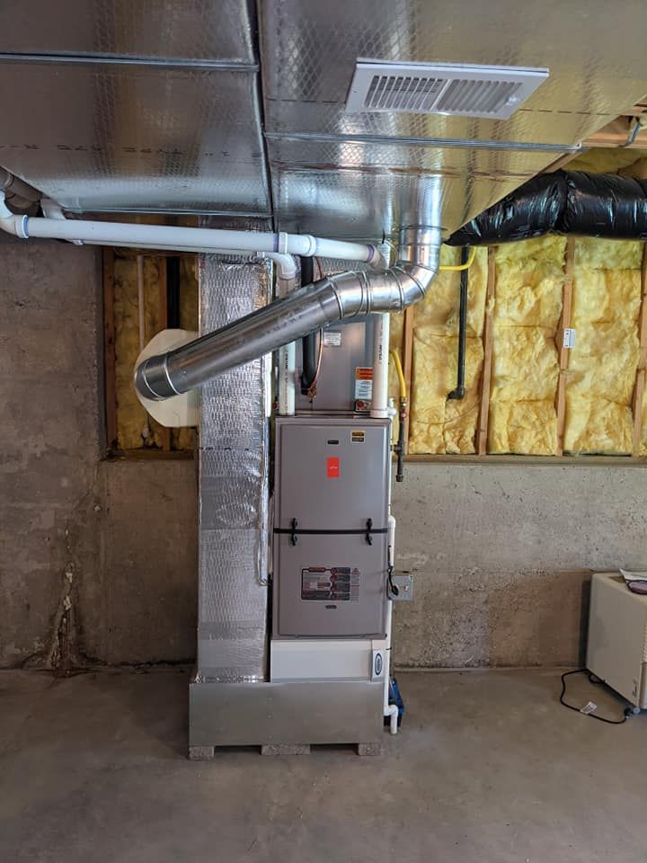 An air conditioner is installed in a basement in a house.