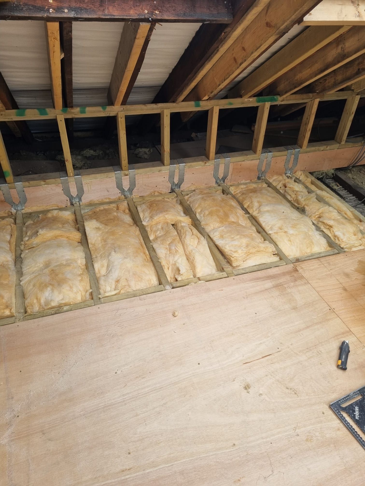 An empty room with a window and a radiator.