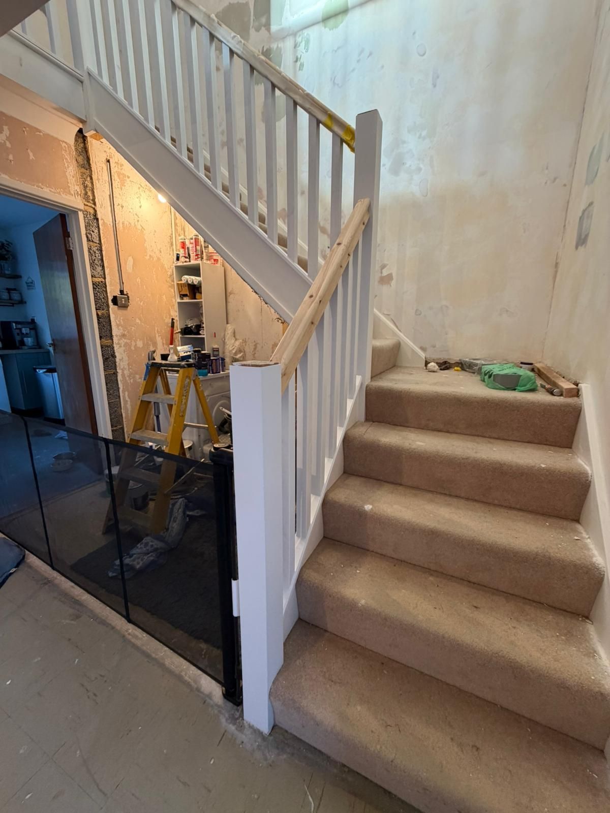 A man is using a drill to drill a hole in a piece of wood.