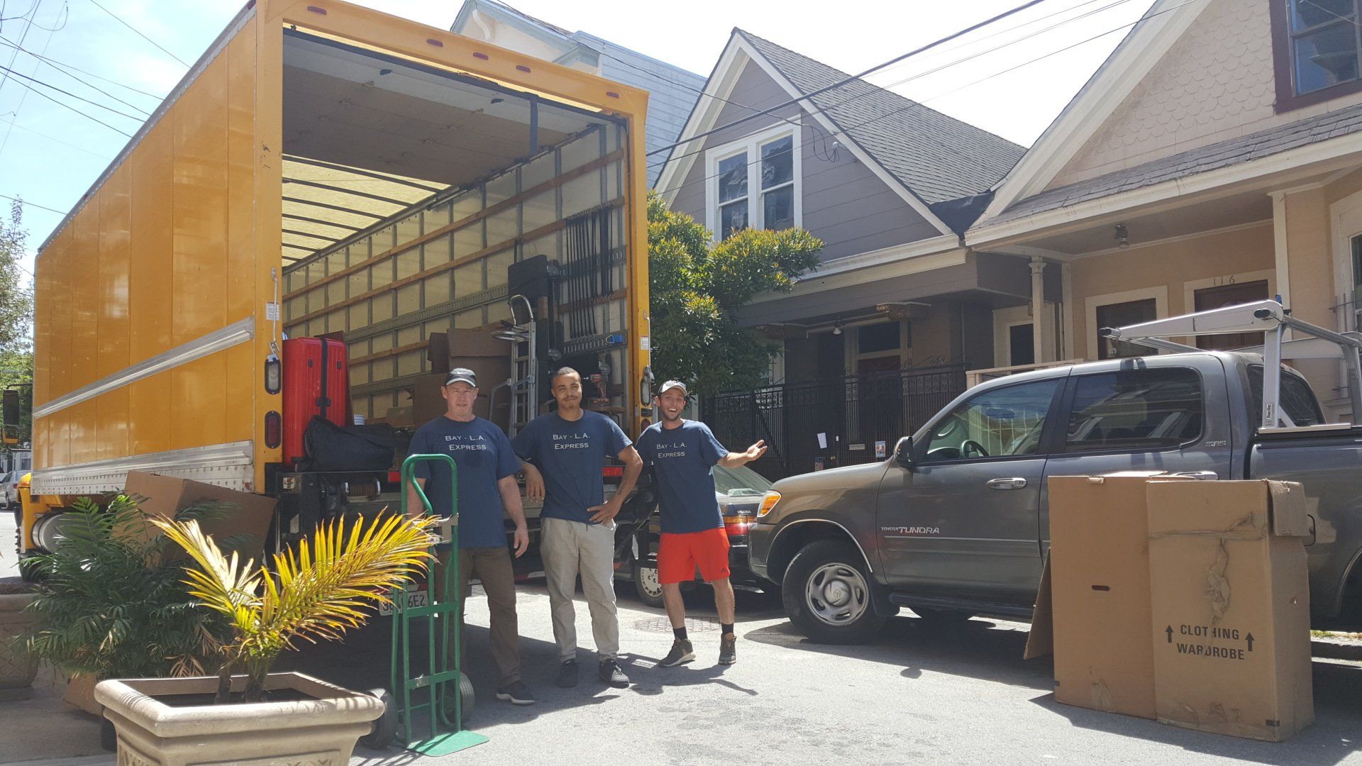 Long-Distance Movers Standing in Front of Truck