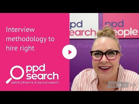 Woman in glasses with pink background text: 