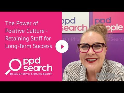 Woman with glasses in front of a pink and white background. Title: 