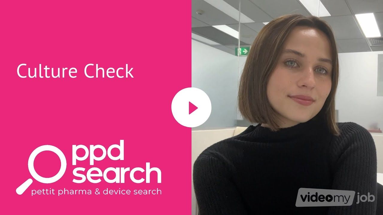 Woman in black sweater, pink background with 