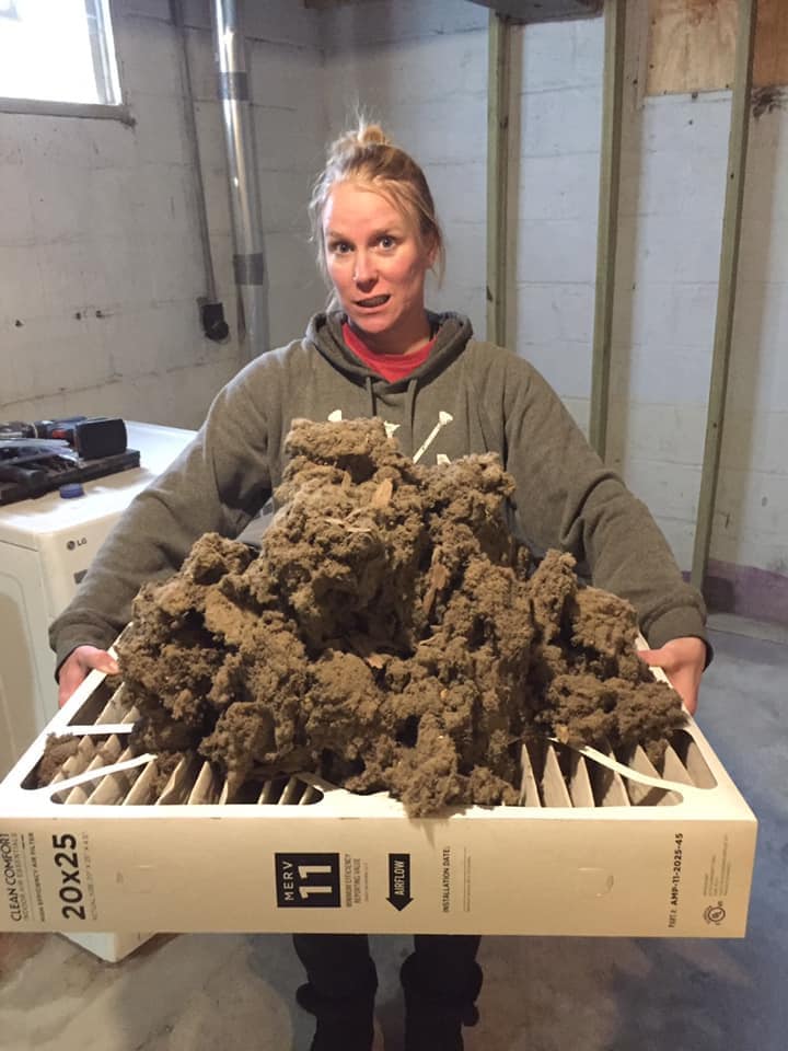 Woman Holding Dust | Willmar, MN | Preferred Air