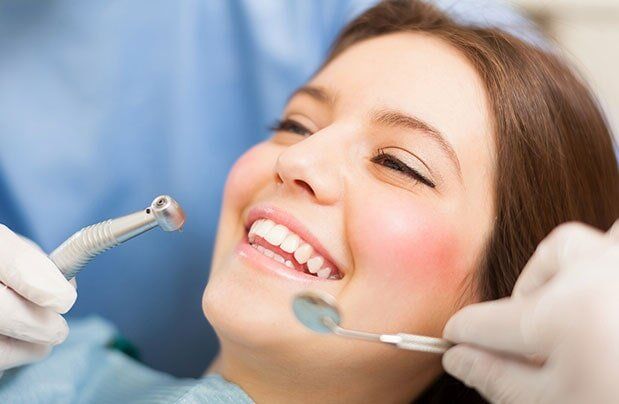 Lady Smiling During Dental Cleaning — Bristol, TN — McMillin & Christian Family Dentistry
