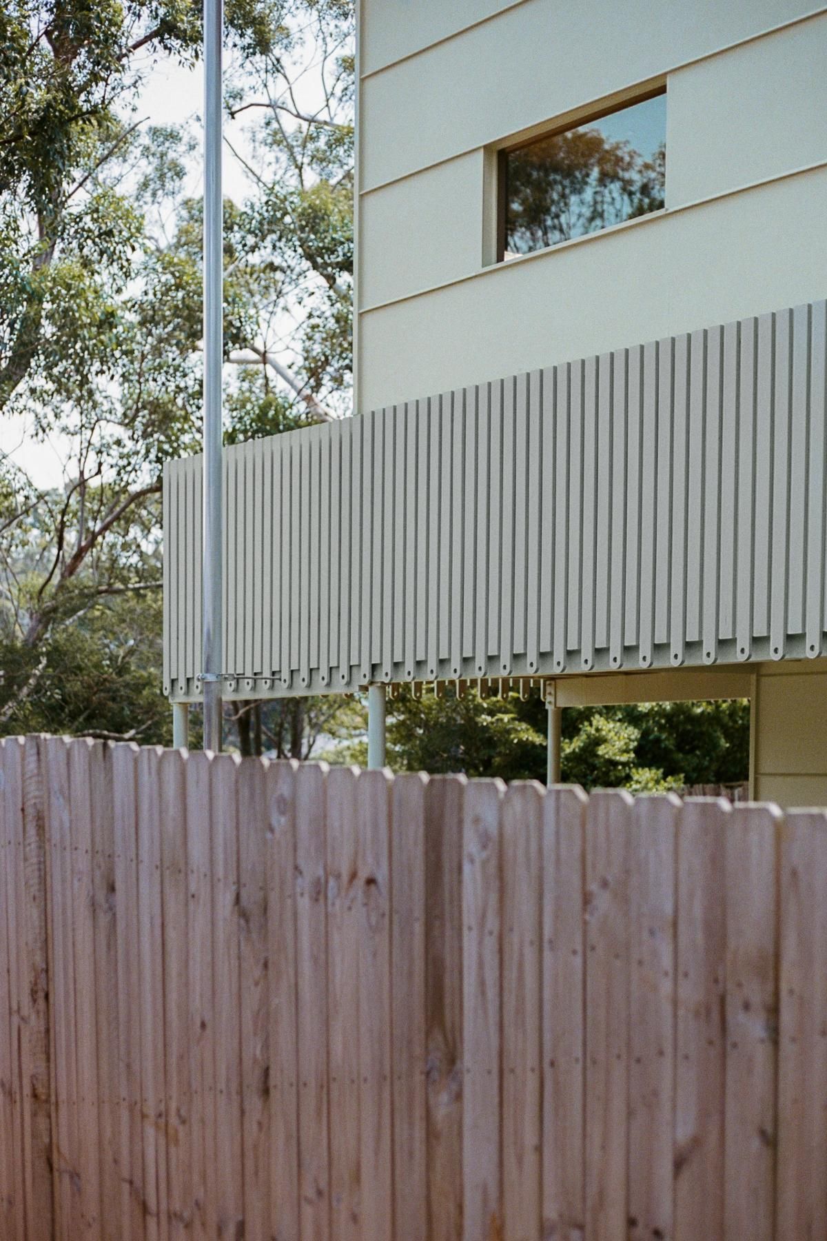 Wooden Fence and Light-coloured Vertical Slats on a Building's Balcony — Envisage Construction and Design in Meadowbank, NSW