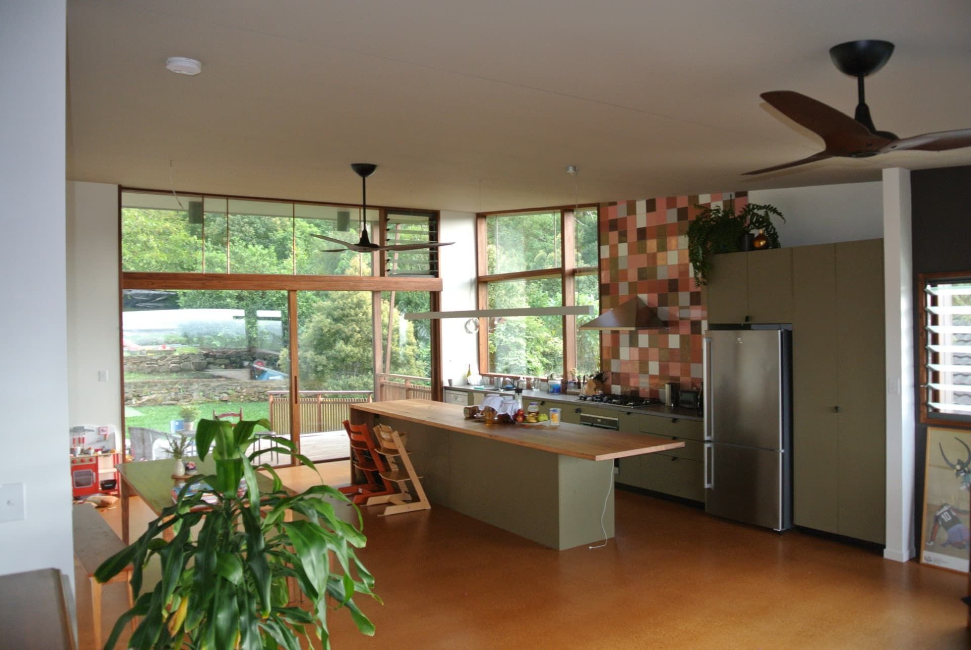 Open-plan Kitchen With a Large Island, Floor-to-ceiling Windows — Envisage Construction and Design in Mountain, NSW