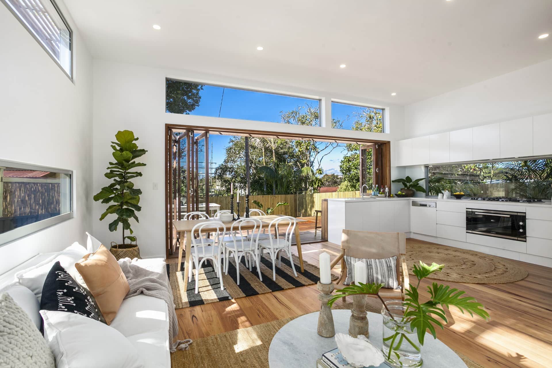 Bright Open-concept Living Room With a Dining Area and Kitchen — Envisage Construction and Design in Keiraville, NSW
