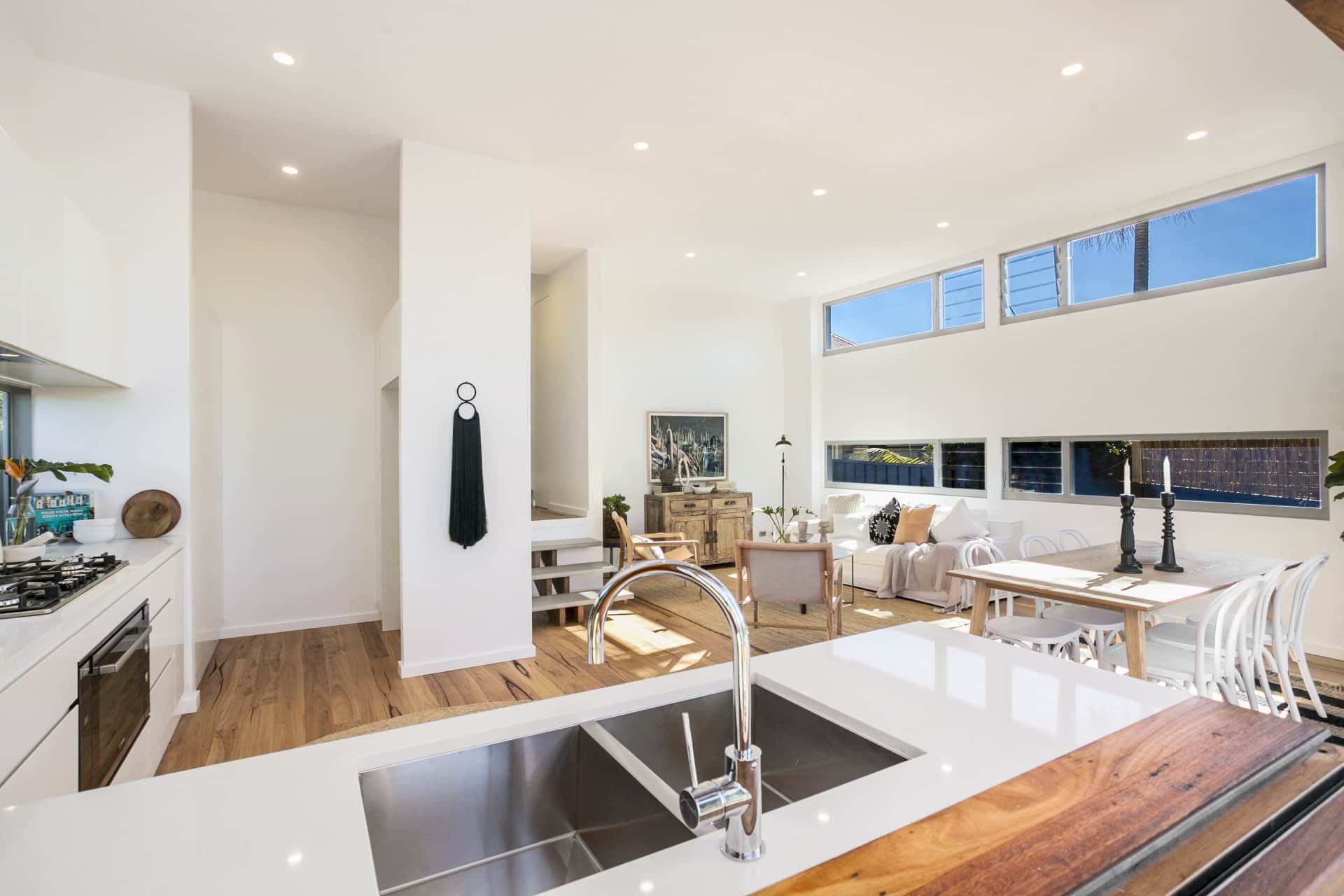 Modern Open-plan Kitchen and Living Room With White Walls — Envisage Construction and Design in Keiraville, NSW