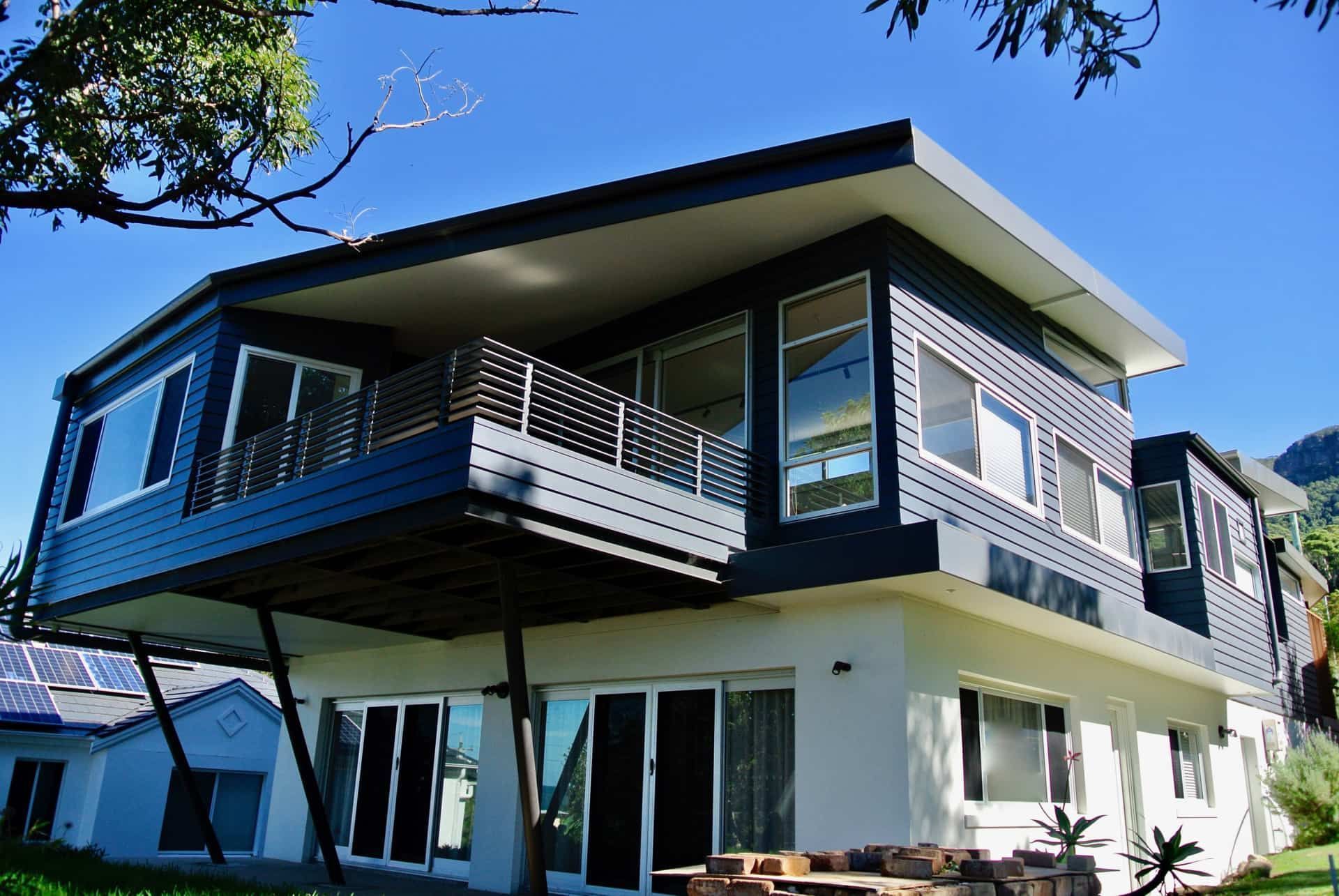 Modern Two-story House With a Dark Blue Upper Level — Envisage Construction and Design in Coledale, NS