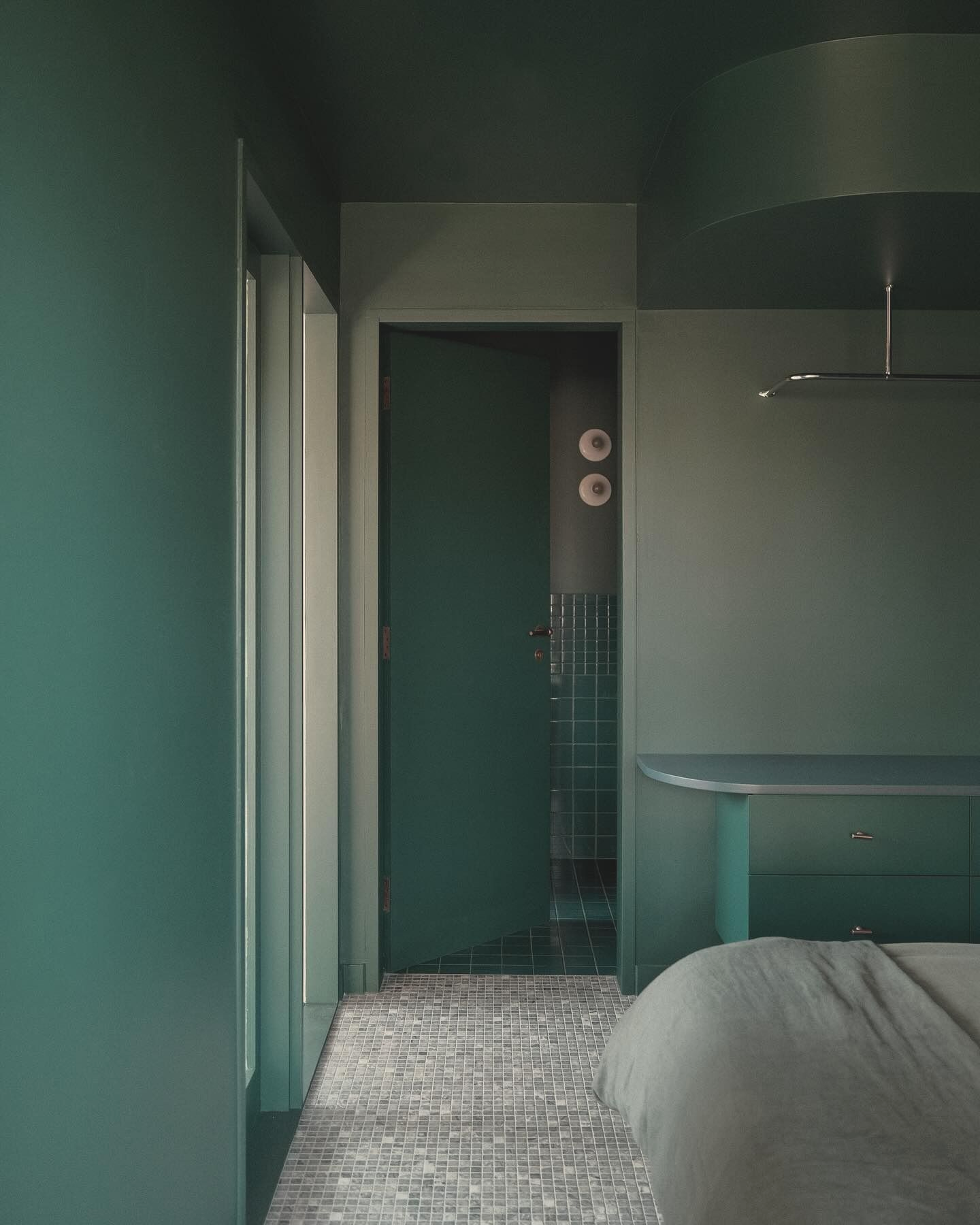 Dark Teal Bedroom With a Door to the Bathroom — Envisage Construction and Design in Mountain, NSW