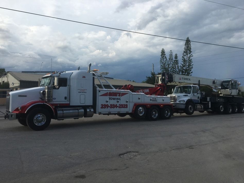 A tow truck is parked on the side of the road
