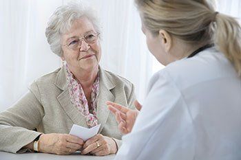 Elderly Woman at Arthritis Screening