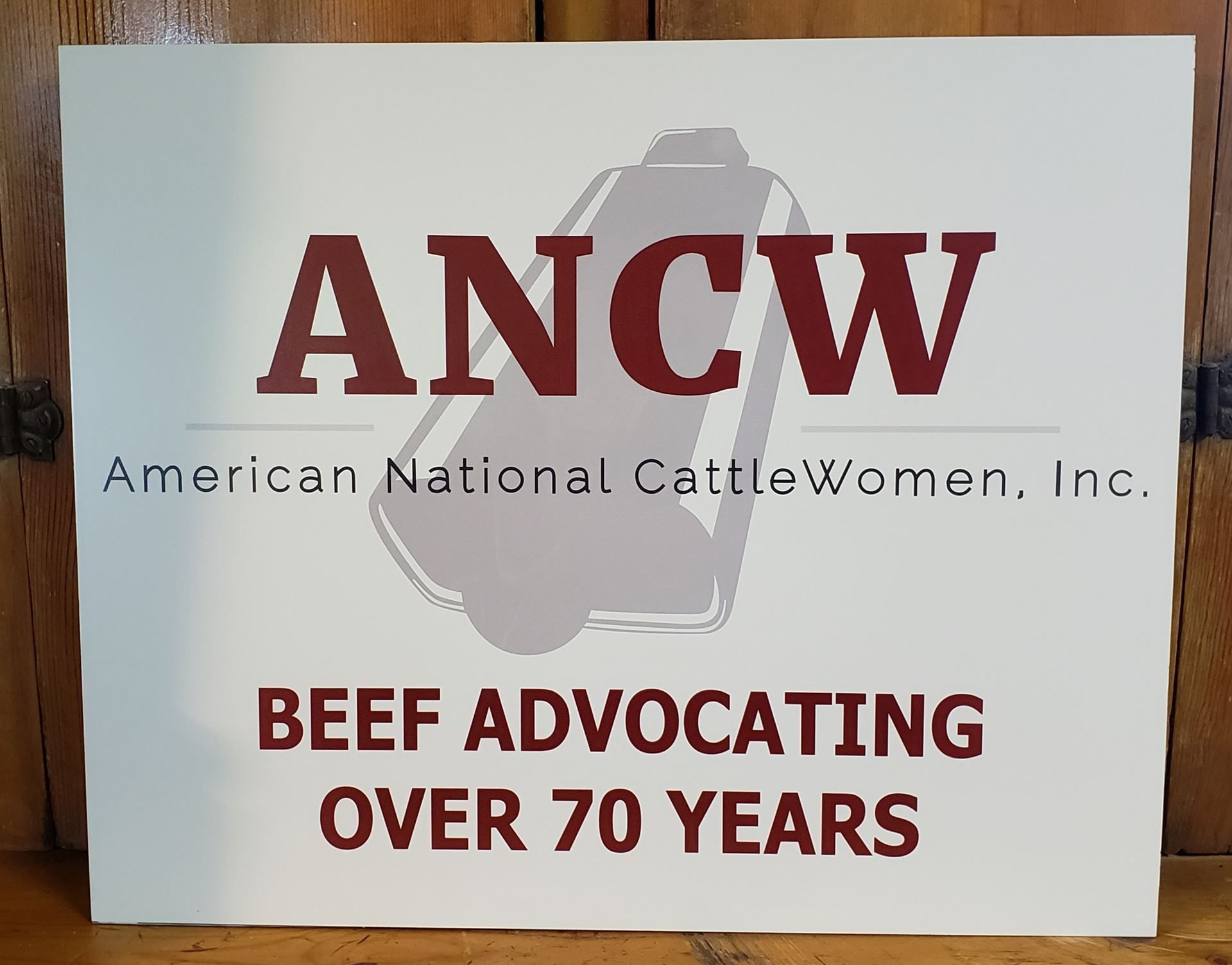 Sign for the American National CattleWomen with logo, text