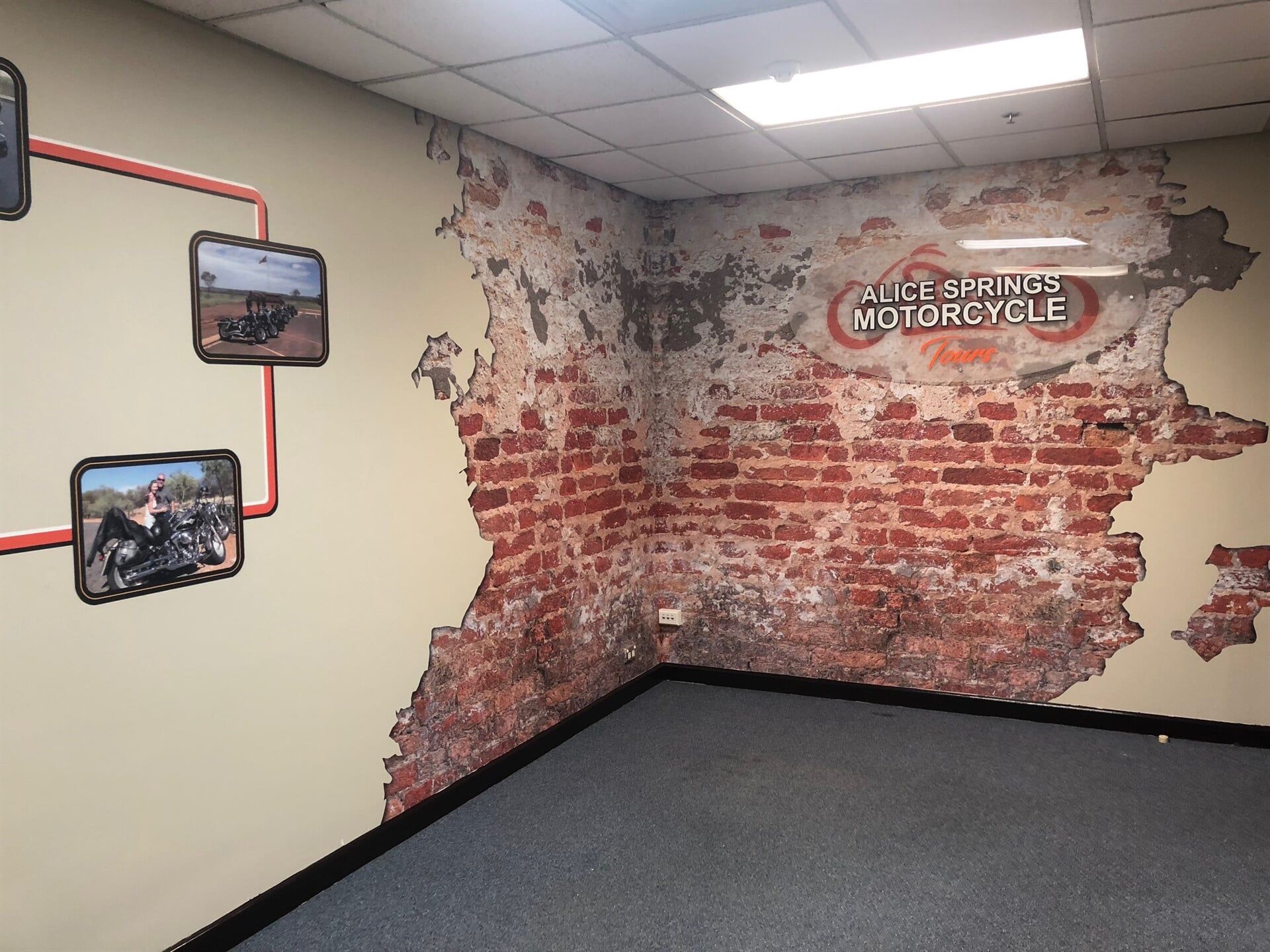 A Room With a Brick Wall and a Sign That Says Motorcycle — Bluey's Signs in Ciccone, NT
