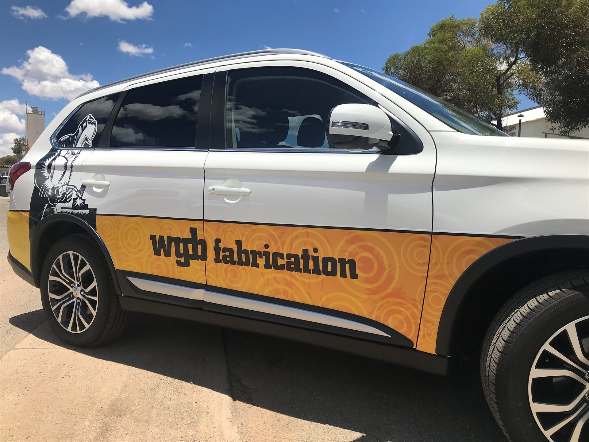 A White and Yellow Car With the Word Fabrication on the Side — Bluey's Signs in Ciccone, NT
