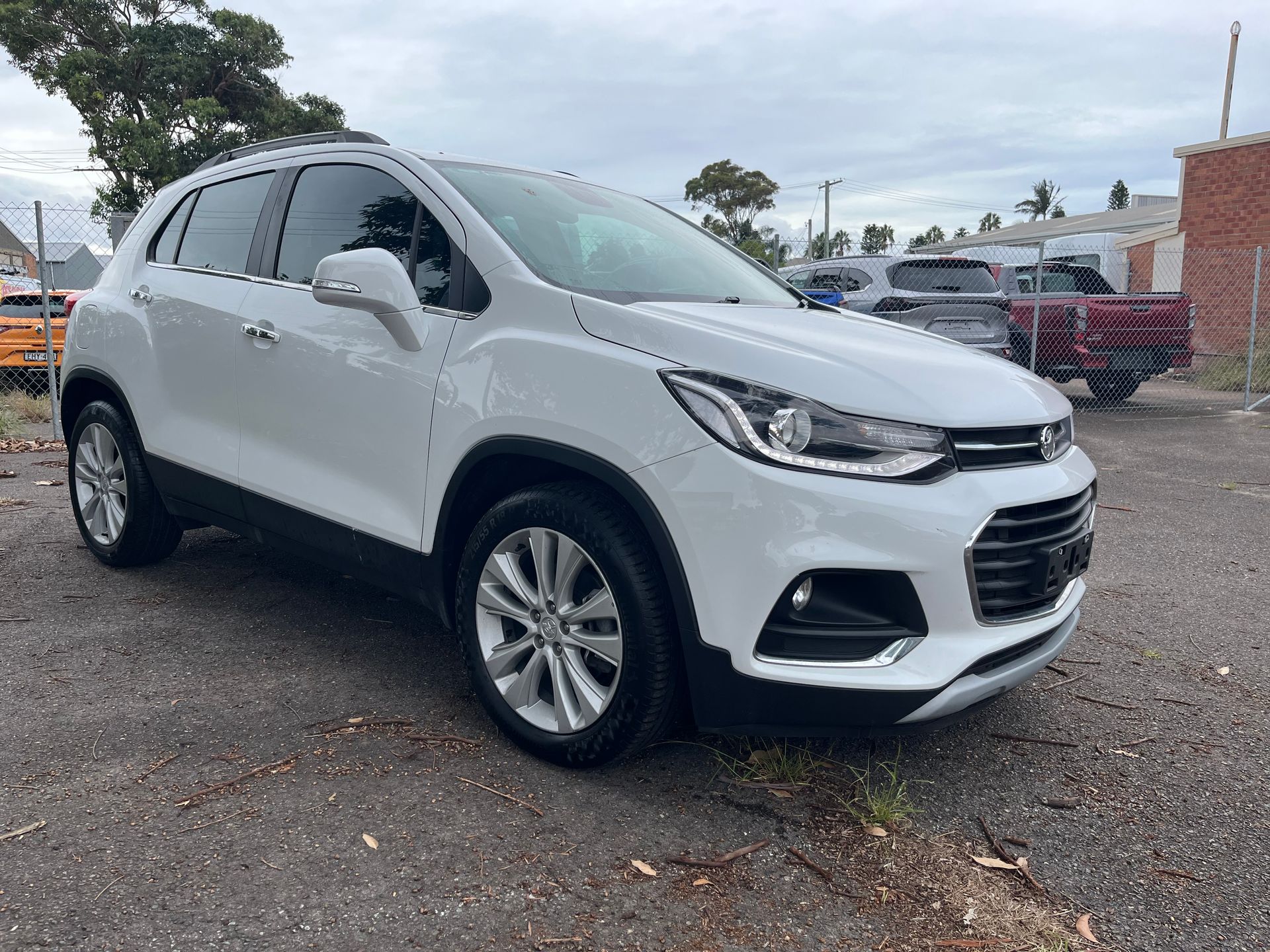A white Chevrolet Trax is parked in a parking lot | Autotek New South Wales
