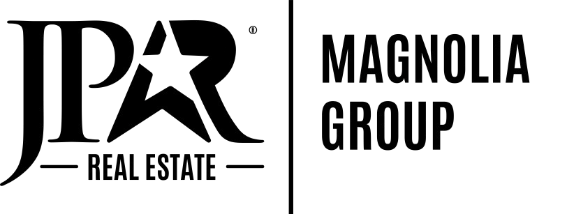 A black and white logo for jpr magnolia group real estate.