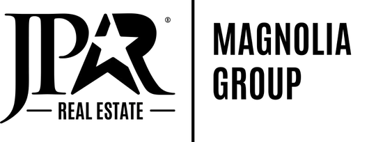 A black and white logo for jpr magnolia group real estate.