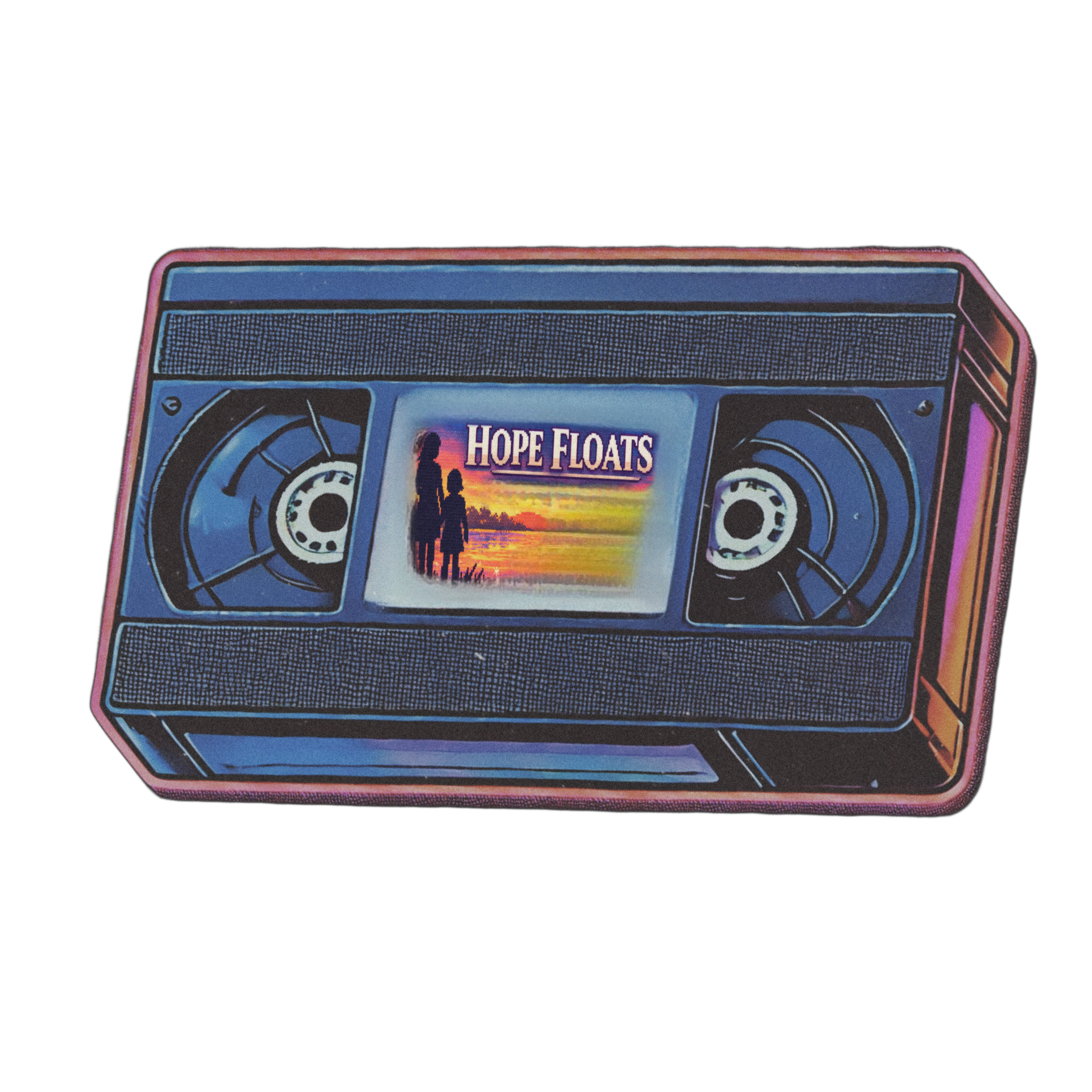 Retro VHS cassette featuring Hope Floats on the label with a sunset silhouette, styled in a nostalgic analog aesthetic, representing emotional memory, heartbreak, and healing within the Searching for Stars multimedia memoir experience by Lauren Nixon-Matney, blending cinematic storytelling with musical echolalia and millennial nostalgia.