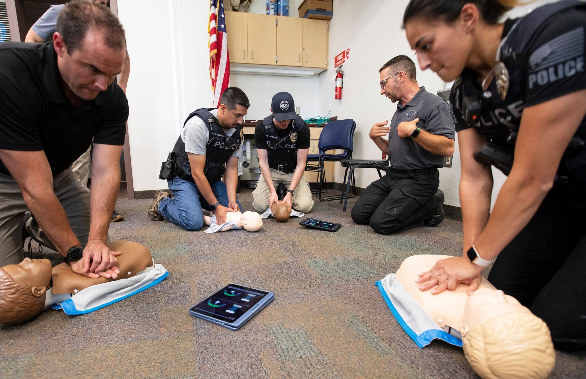 Tim Freund, a SWAT medic and director of training for Griffith Blue Heart, instructs Flagstaff police officers on increasing their cardio-cerebral resuscitation performance.