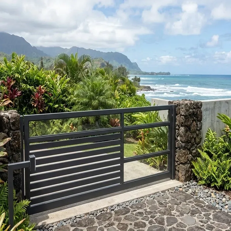 Modern aluminum driveway gate installed at a residential home in Oahu Hawaii designed to resist salt air humidity and strong tropical sun.