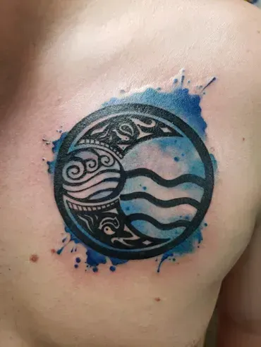 A man has a tattoo of the four elements on his chest.