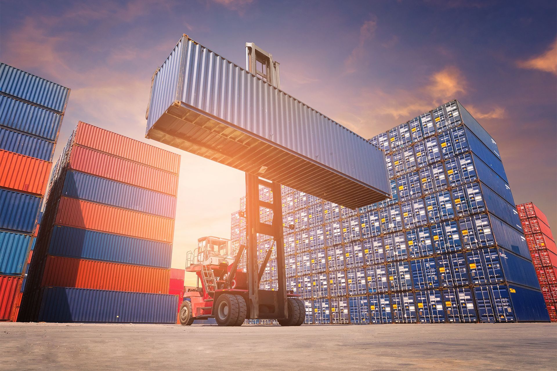 Forklift Lifting a Shipping Container