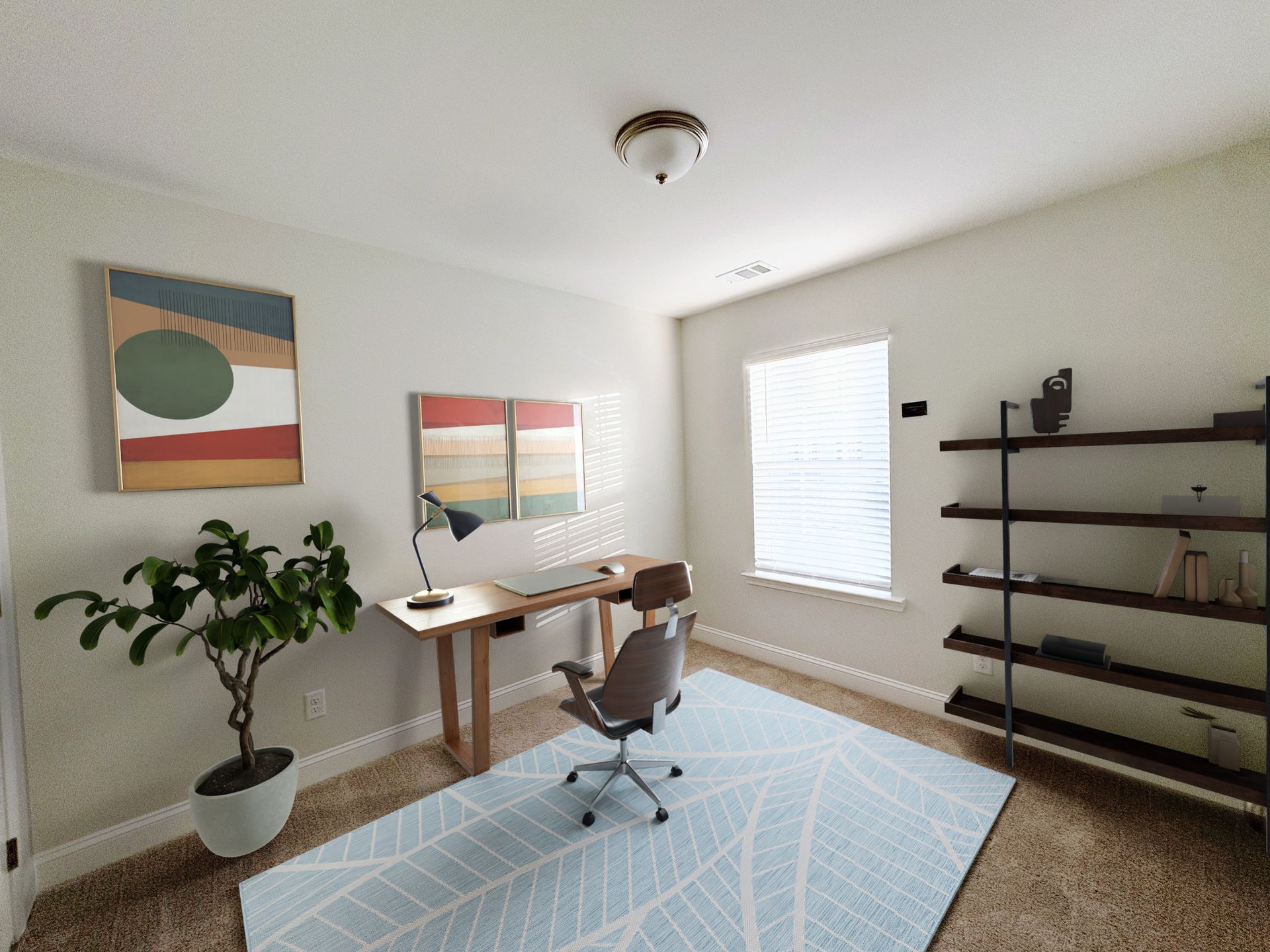 Home office with desk, chair, rug, and artwork. A plant and shelves are visible. Bright room with natural light.