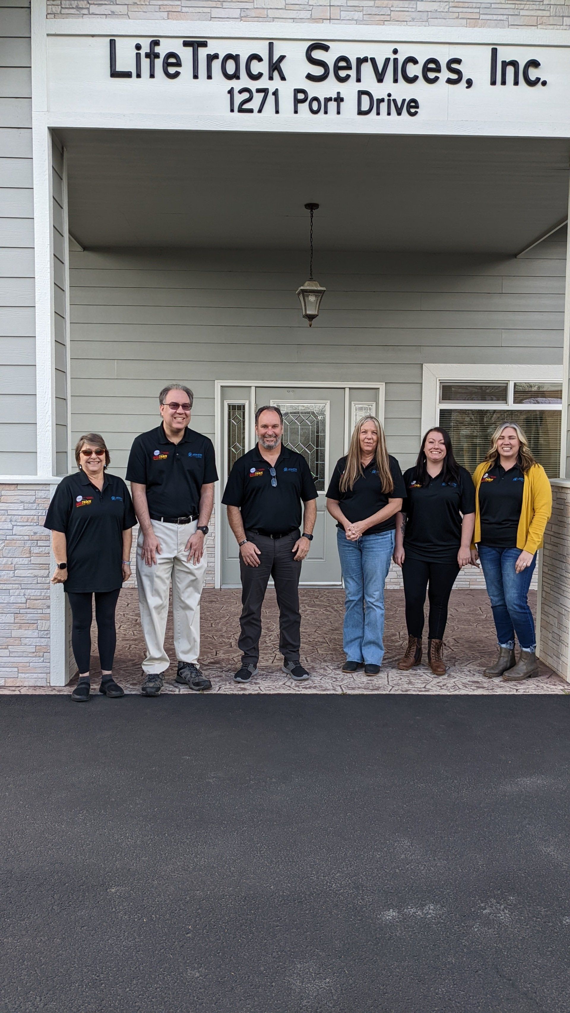 LifeTrack Services staff posing in front of their office building at 1271 Port Drive.