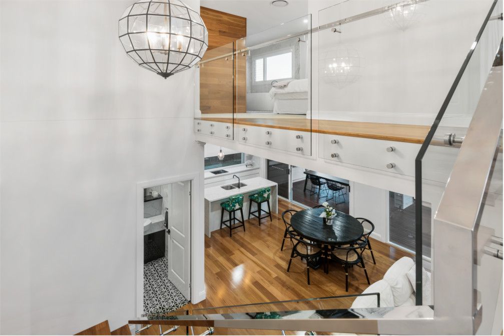 A view of a living room from the second floor of a house. — Peter Betros Homes in Highfields, QLD