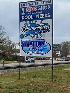 A sign that says free water testing for all of your pool needs
