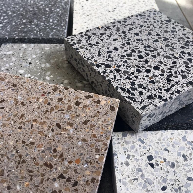 A Bunch of Different Colored Tiles Are Stacked on Top of Each Other — Dean Gray Tiling in Gold Coast, QLD