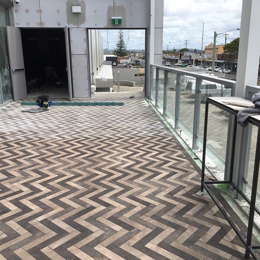 A Walkway With a Chevron Pattern — Dean Gray Tiling in Palm Beach, QLD