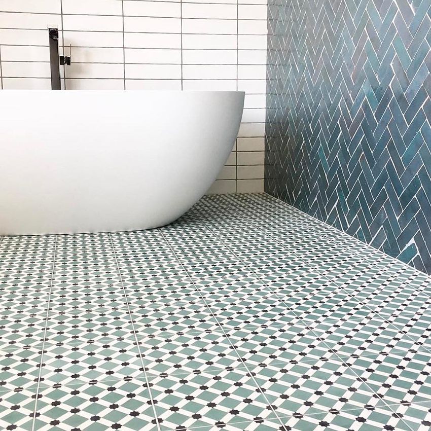 A Bathroom With a Bathtub and a Tiled Floor — Dean Gray Tiling in Burleigh, QLD