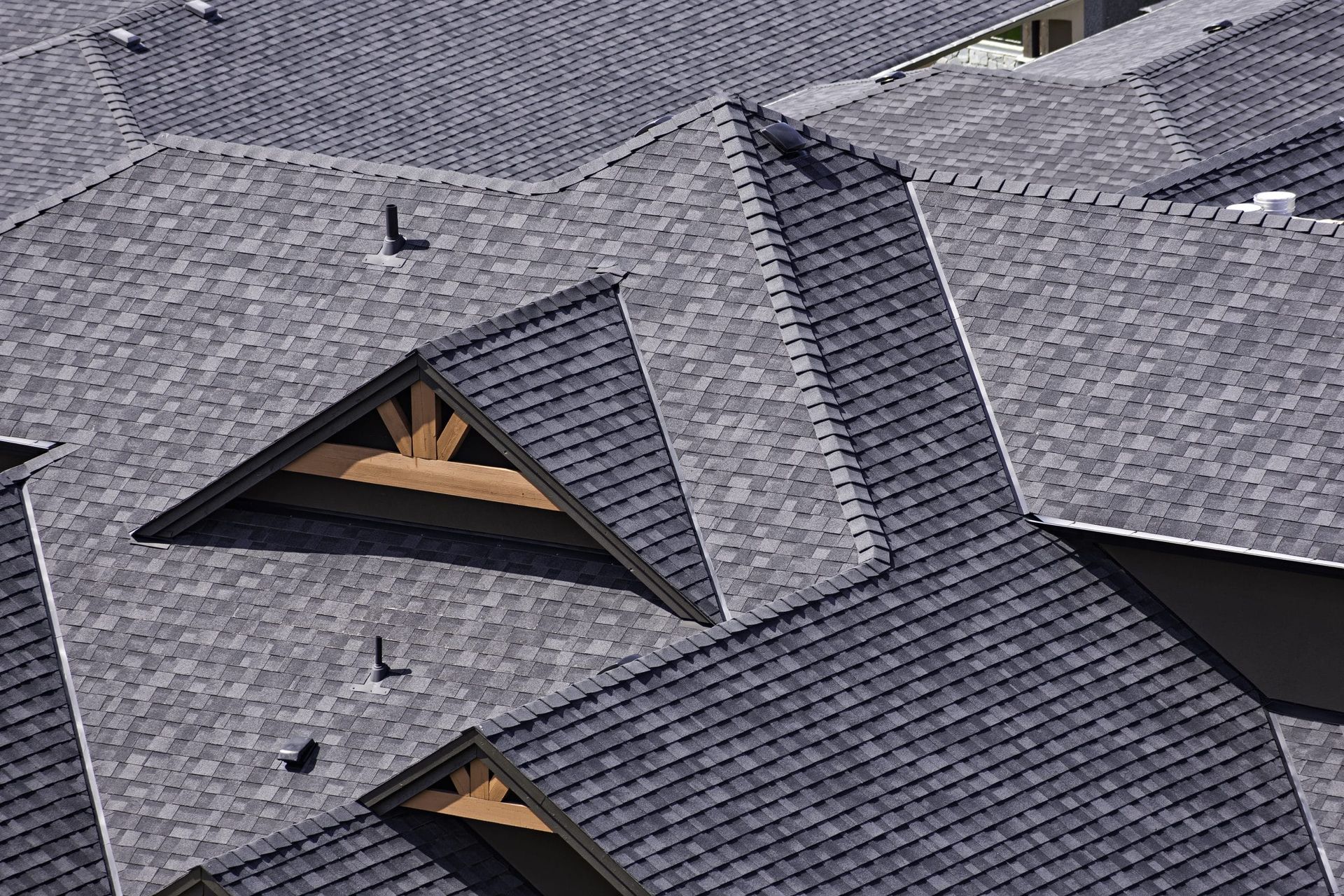 A close up of a roof with a lot of shingles on it.