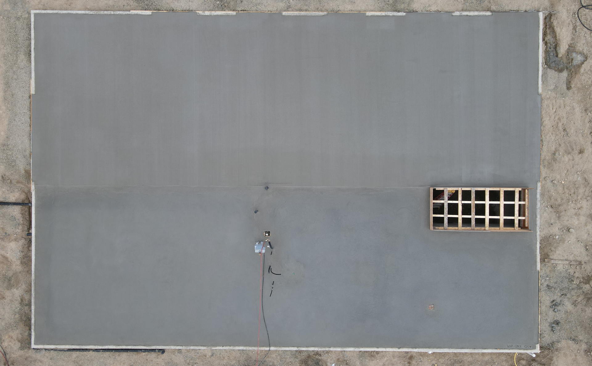 An aerial view of a building with a window on the side. Done by Raise the Bar Construction 
