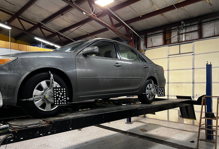 Gray Car on a Lift in a Garage | 6 to 6 Auto Service