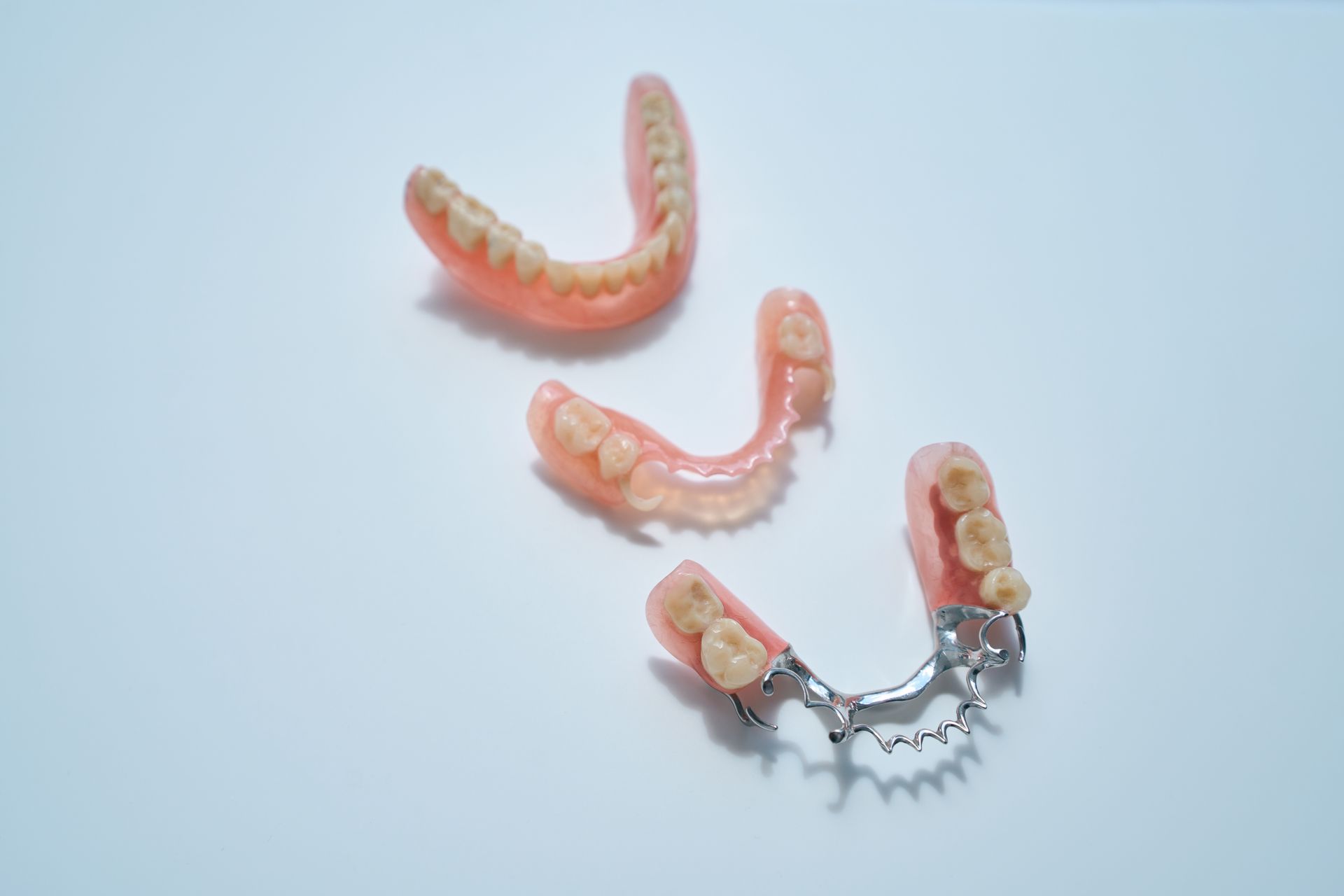 Dentures and partial dentures showing removable dental prosthetics used to replace missing teeth