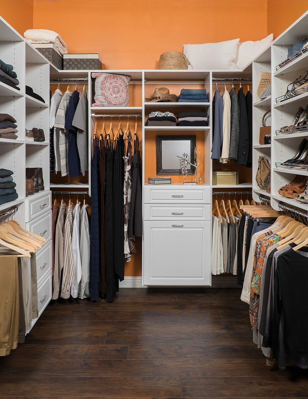 Well organized his and hers custom closet system.