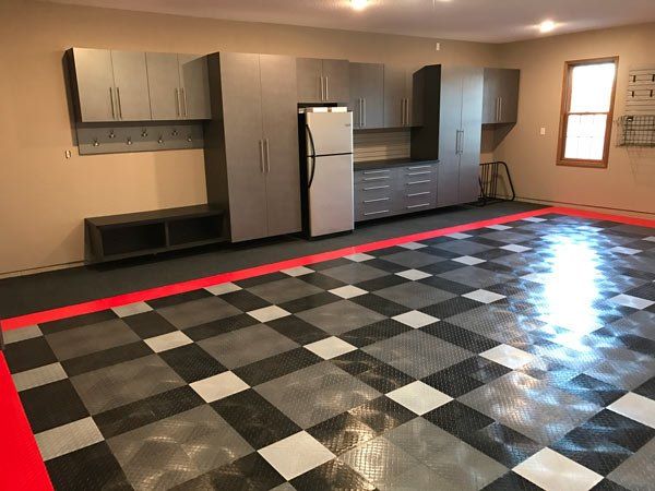Custom Garage with Cabinets and Tile Floors