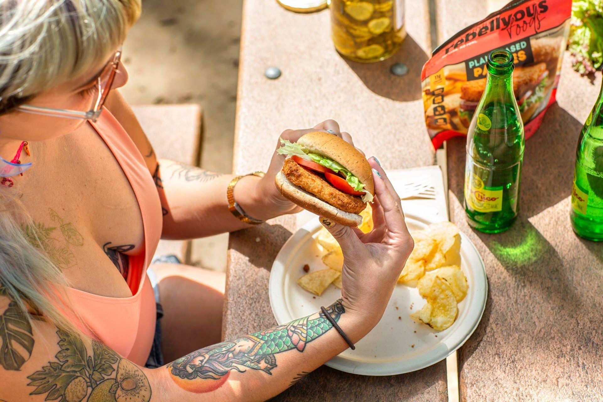 woman eating rebellyous sandwhich