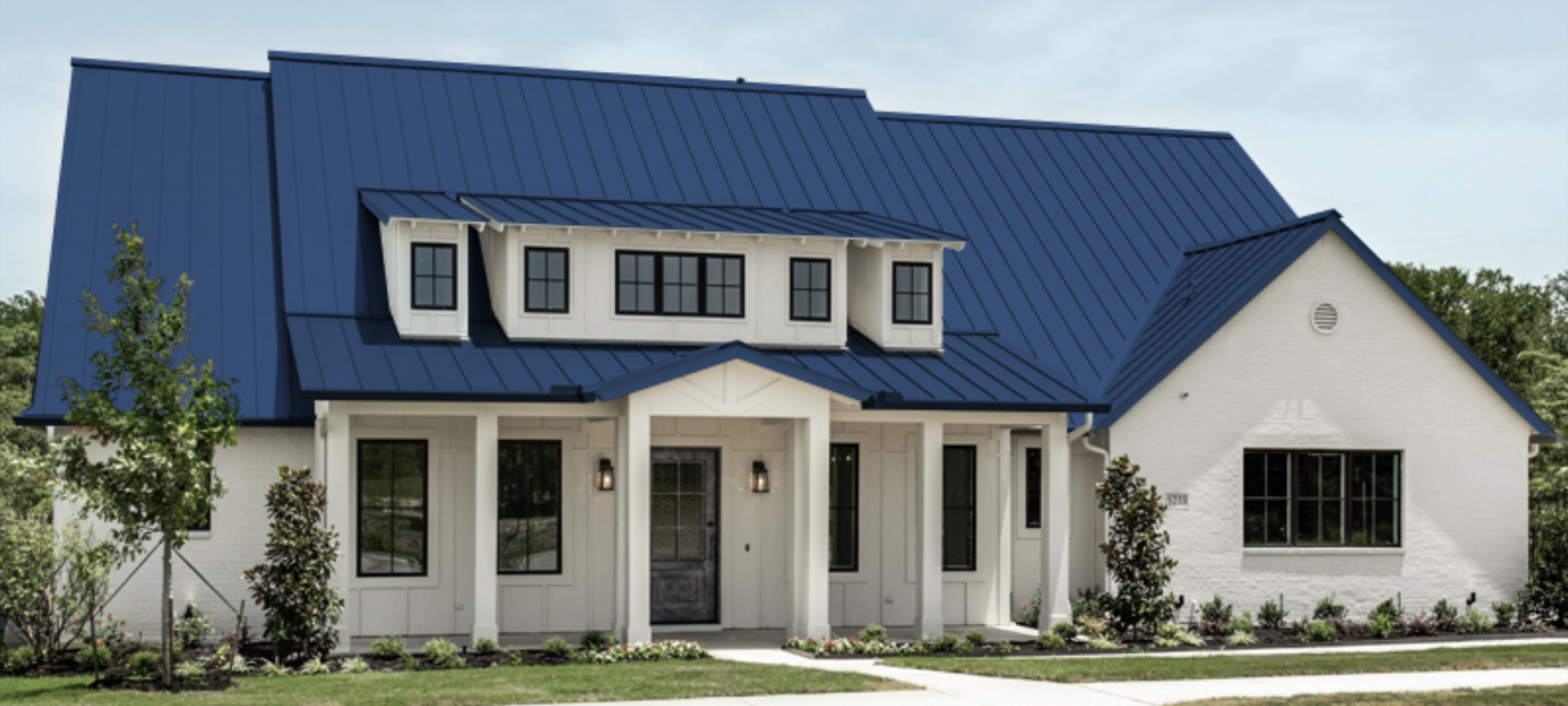 Blue Metal Roof With White Siding