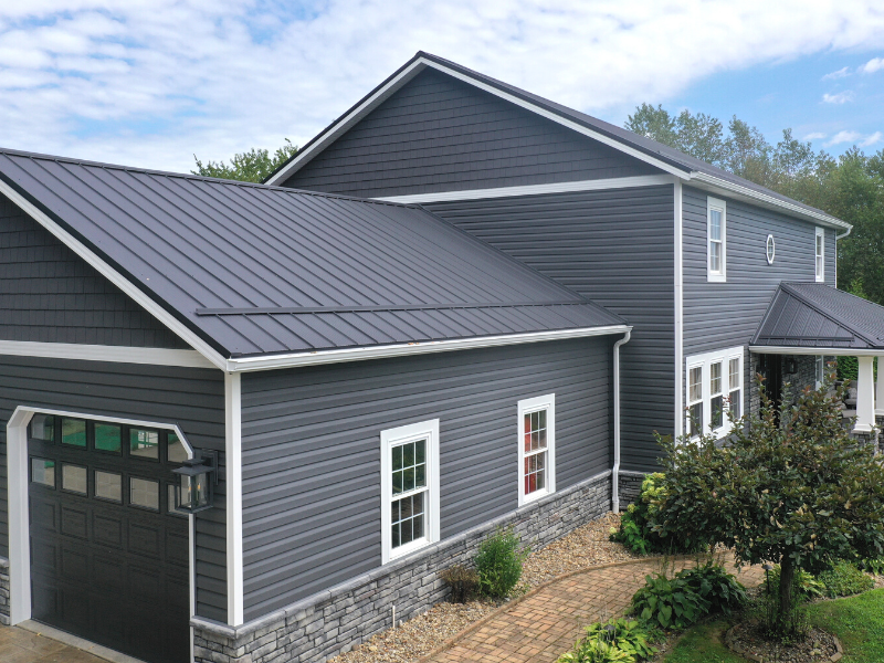 Black Metal Roof With Gray Siding