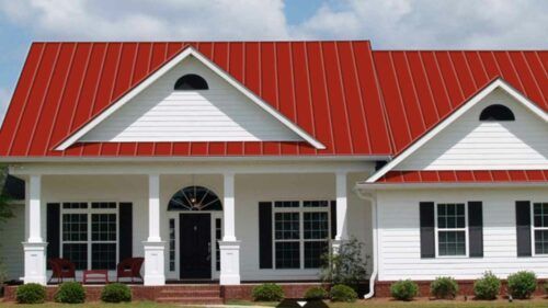 Red Metal Roof With Cream Siding