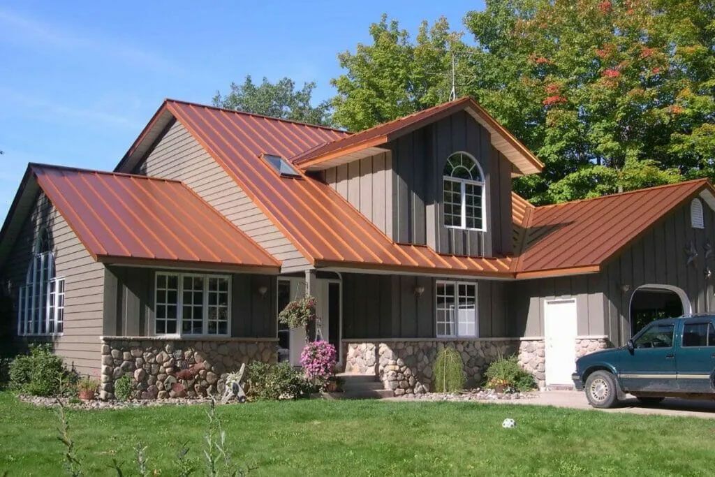 Warm and Inviting: Copper Metal Roof With Brown Siding